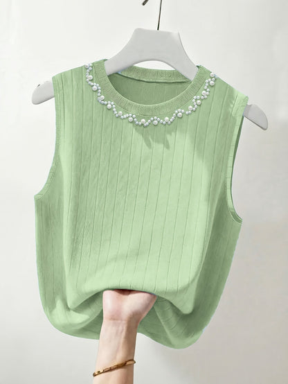 Elegante dames mouwloze top met parelmoerlook en ronde hals, geschikt voor uitgaan of kantoor