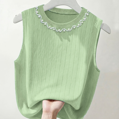 Elegante dames mouwloze top met parelmoerlook en ronde hals, geschikt voor uitgaan of kantoor