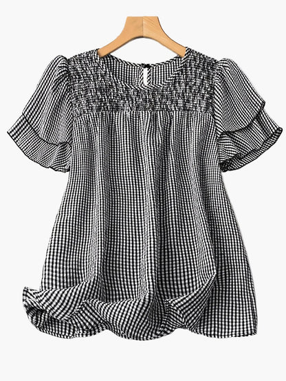 Rutig blus i avslappnad stil för kvinnor, perfekt för vår och sommar