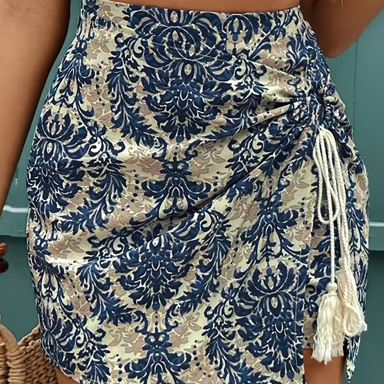 Elegant women's wrap skirt summer style with floral pattern and gathered detail