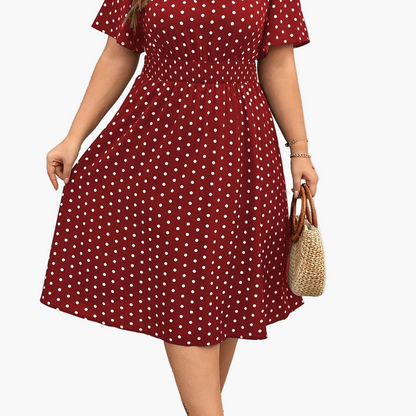 Elegancka sukienka damska w groszki w stylu lat 50. Rozkloszowana na lato