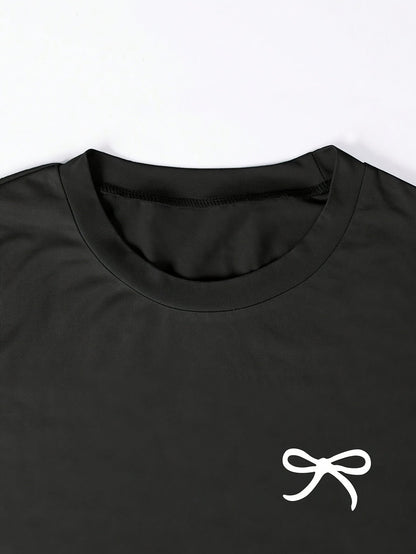 T-shirt femme casual chic à manches courtes avec nœud brodé, style élégant pour usage quotidien