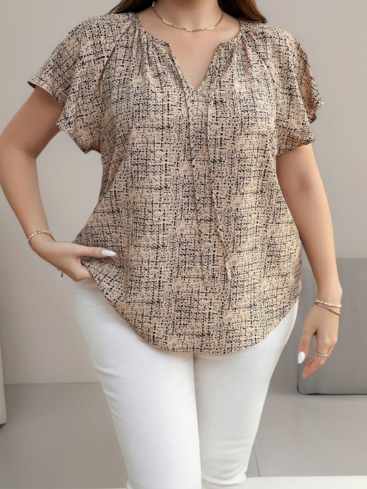 Bluzka damska w stylu casual z nadrukiem graficznym i dekoltem w serek, idealna na lato