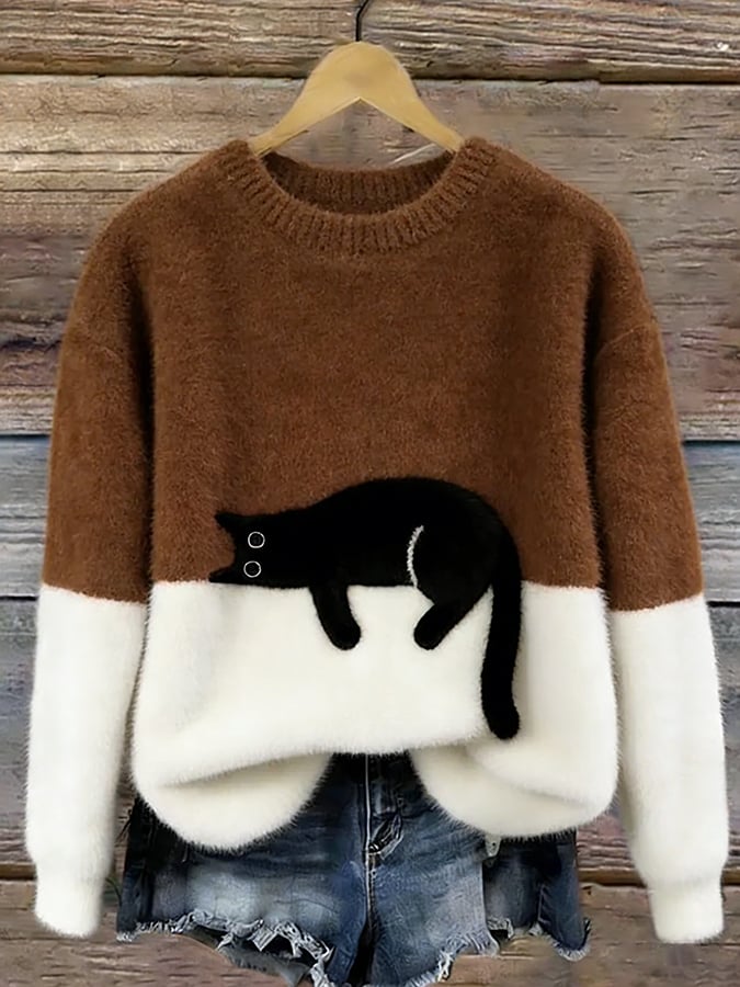 Cozy two-tone sweater with black cat motif, long sleeves and crew neck