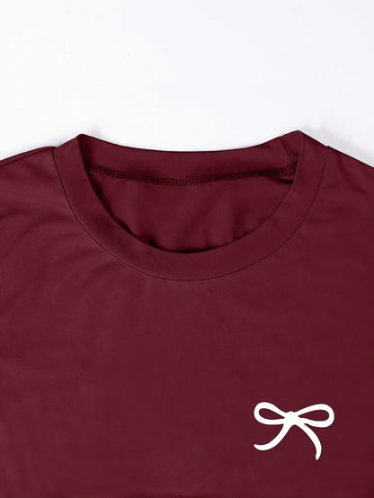 T-shirt femme casual chic à manches courtes avec nœud brodé, style élégant pour usage quotidien