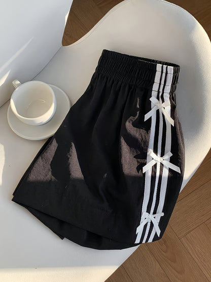 Short décontracté femme style vacances avec nœuds latéraux et bandes sportives