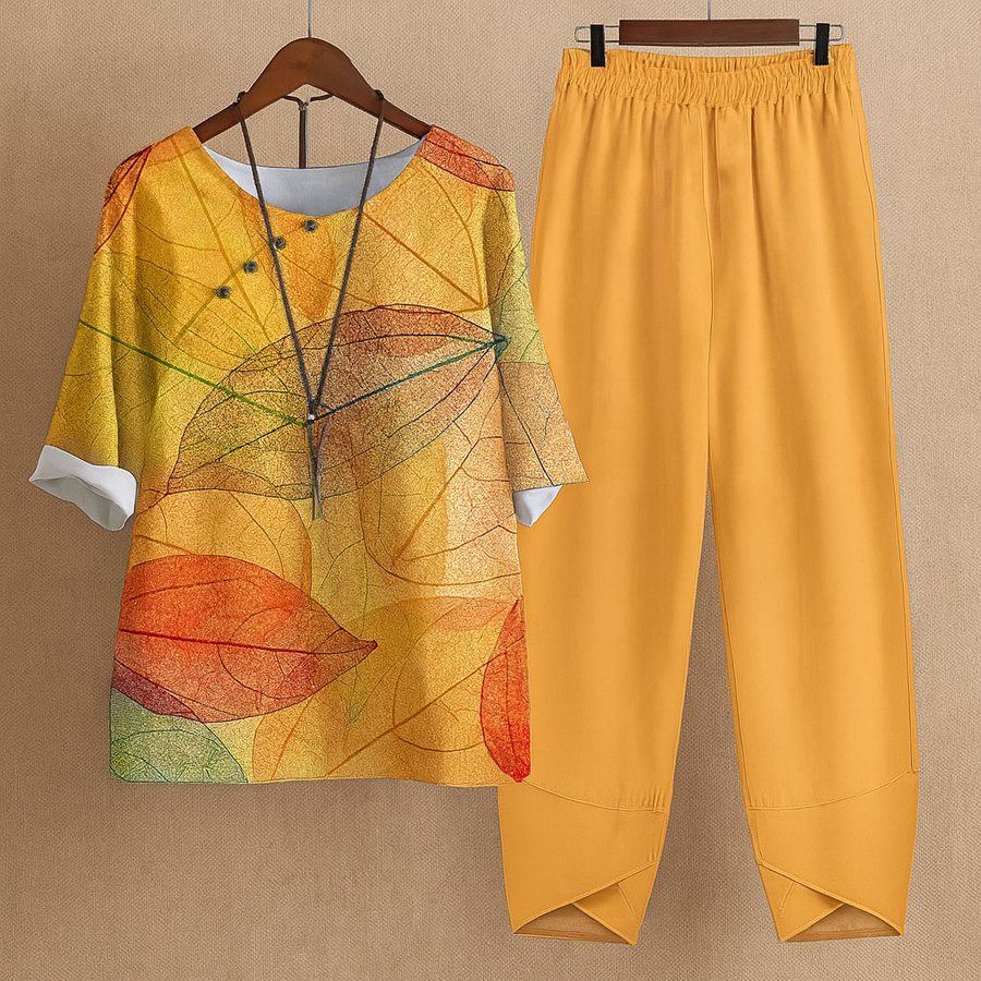 Damen-Zweiteiler aus Bluse und weiter Hose mit gelb-orangefarbenem Blätterprint