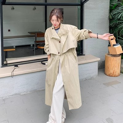 Trench-coat long beige femme à col montant et taille ajustable