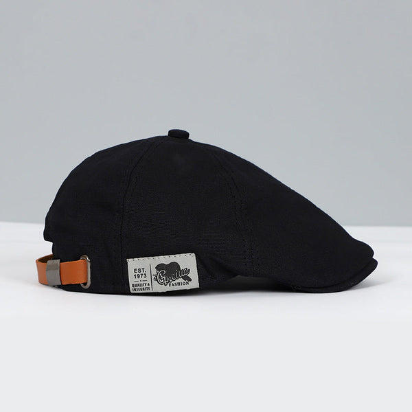 Justerbar flat caps i beretstil med rem i skinnlook - svart