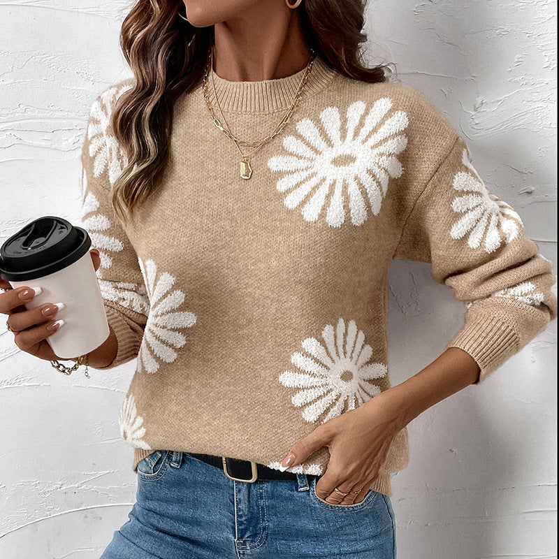Beige gebreide trui met wit bloemenmotief en ronde hals