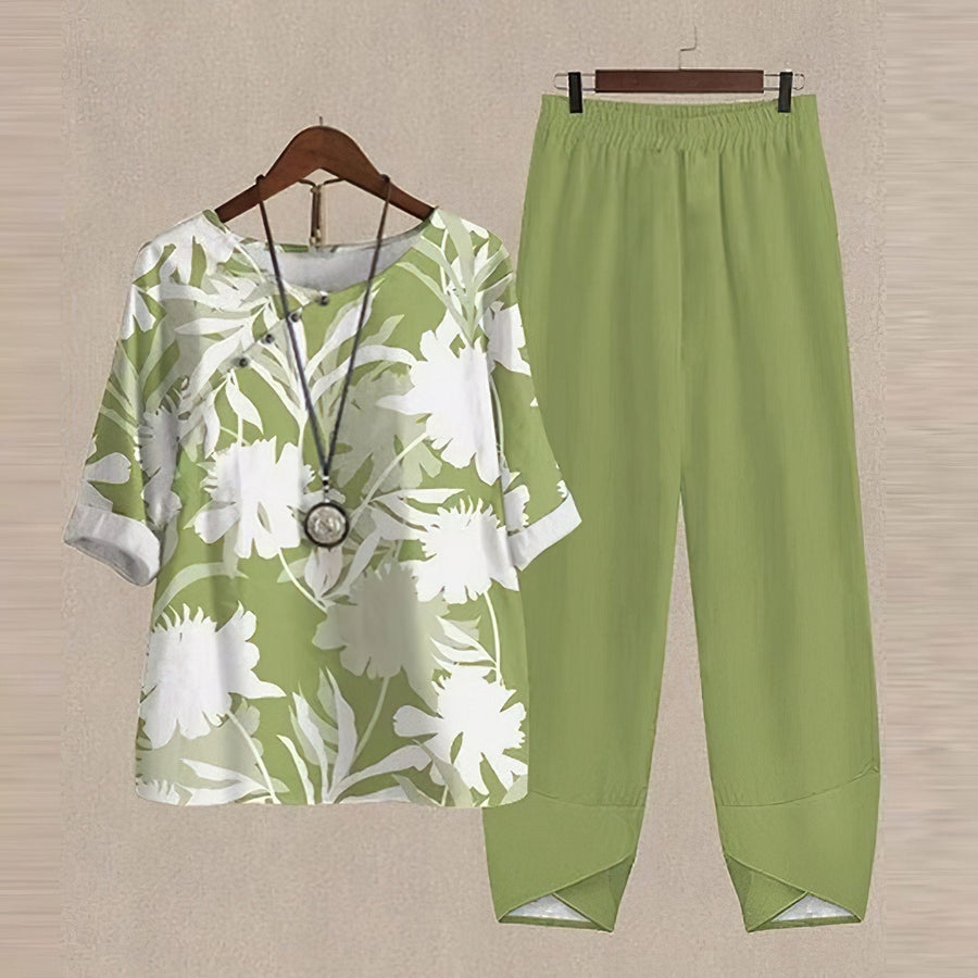 Damen-Zweiteiler aus Bluse und weiter Hose mit gelb-orangefarbenem Blätterprint
