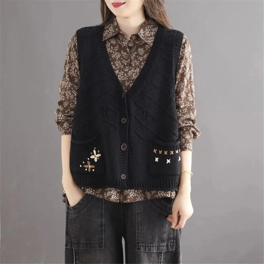 Women's open-knit sleeveless vest with V-neck, buttons, and floral embroidery