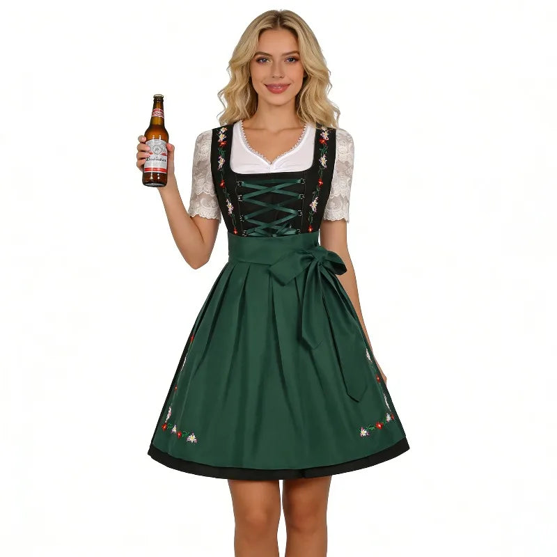 Traditionel grøn og sort dirndl-kjole med blomsterbroderier og hvid bluse