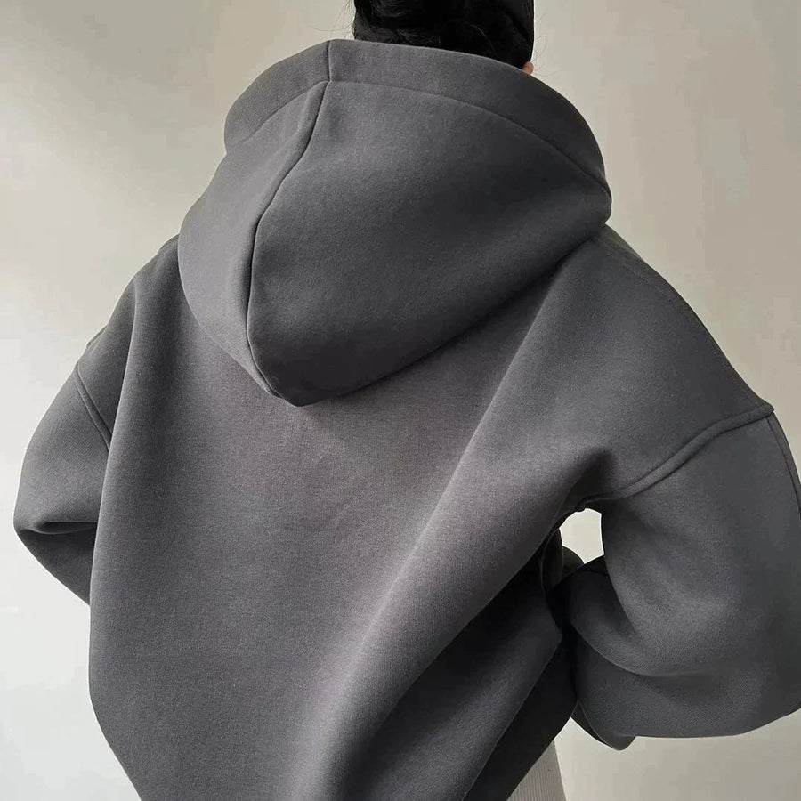 Oversized hettegenser med tykk V-hals i ensfarget design
