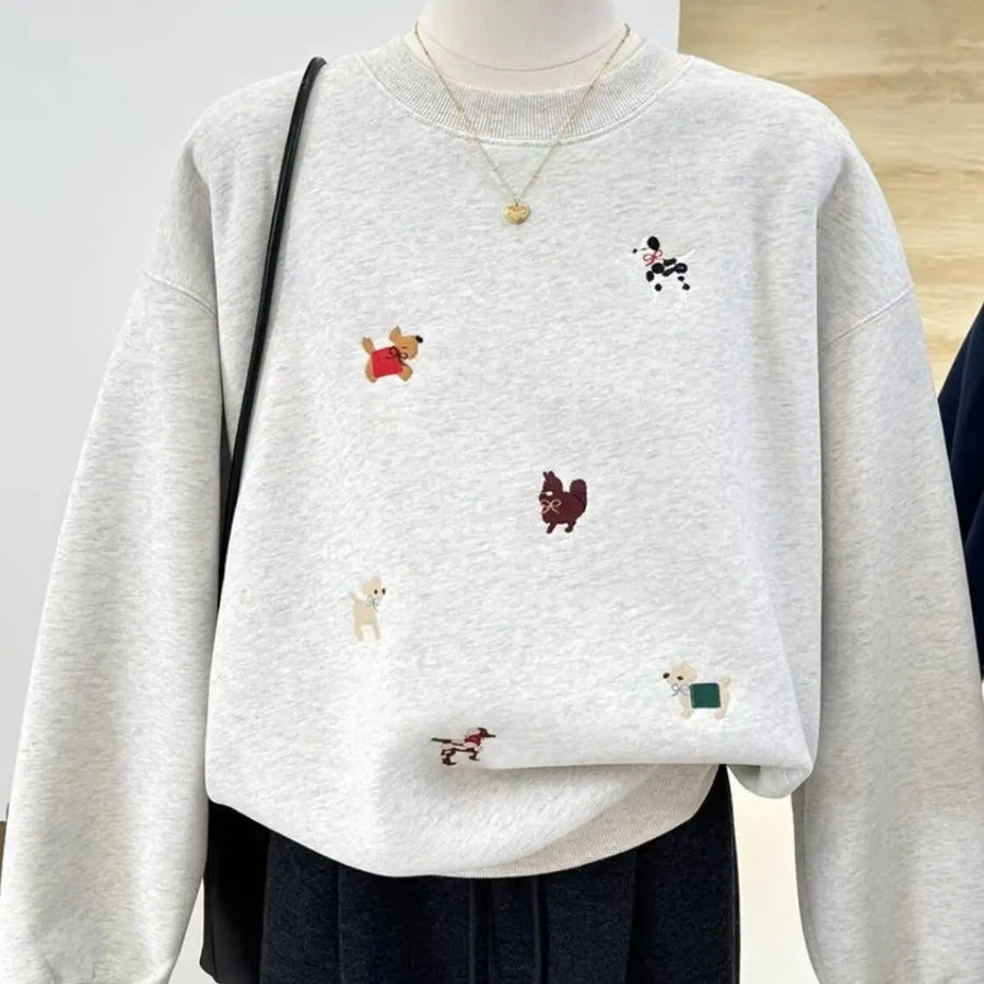 Comfortabel damessweatshirt met ronde hals, geborduurde hondenmotieven en lange mouwen
