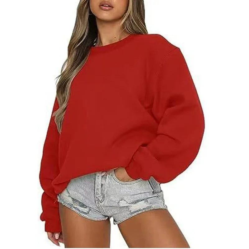 Ensfarvet, løstsiddende sweatshirt til kvinder med rund hals og lange ærmer