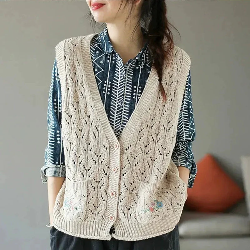 Women's open-knit sleeveless vest with V-neck, buttons, and floral embroidery