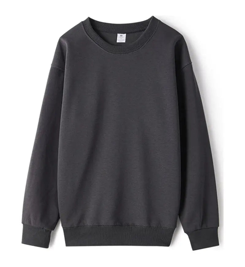 Avslappnad unisex sweatshirt med rund hals, långa ärmar och enfärgad design
