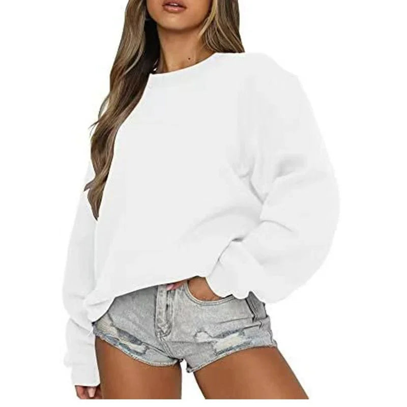 Ensfarvet, løstsiddende sweatshirt til kvinder med rund hals og lange ærmer
