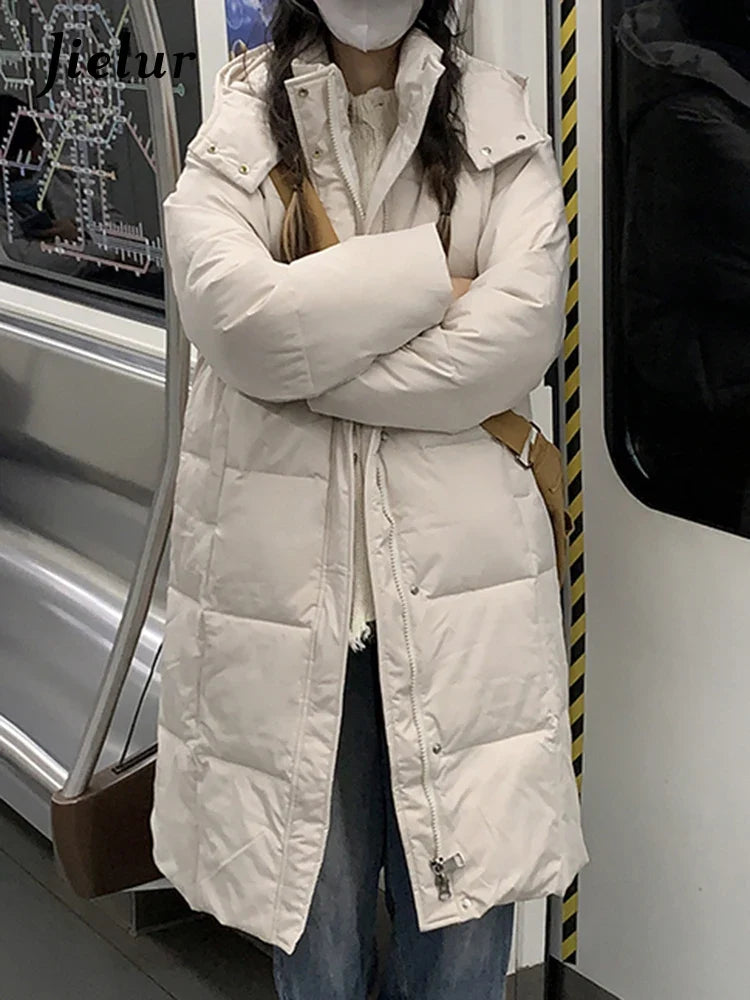 Lång vadderad damjacka med huva, enfärgad