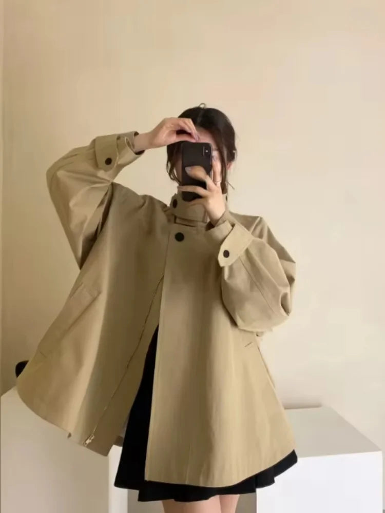 Loose-fitting mid-length women's jacket with stand-up collar, buttons, and hood