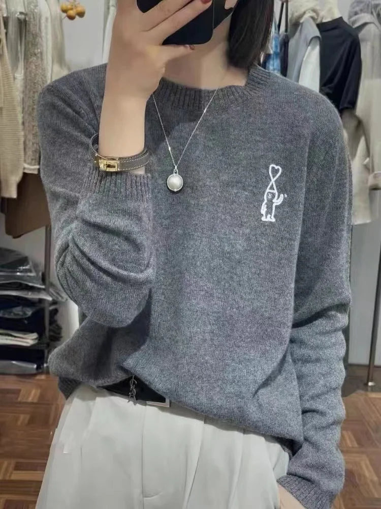Maglione da donna con collo rotondo, motivo ricamato e colori a tinta unita
