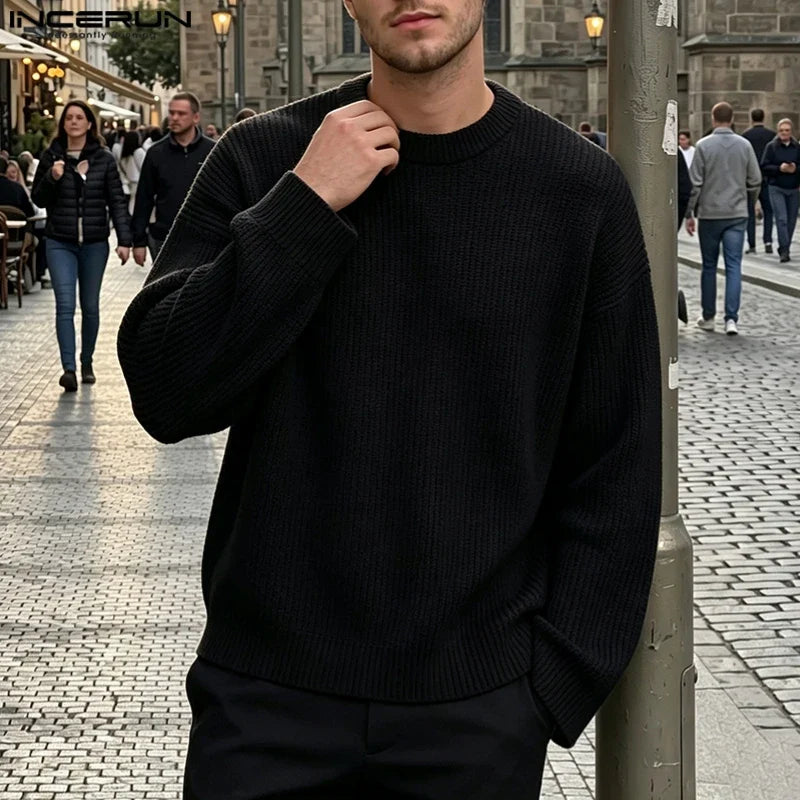 Men's loose-fit black ribbed crew-neck sweater with long sleeves