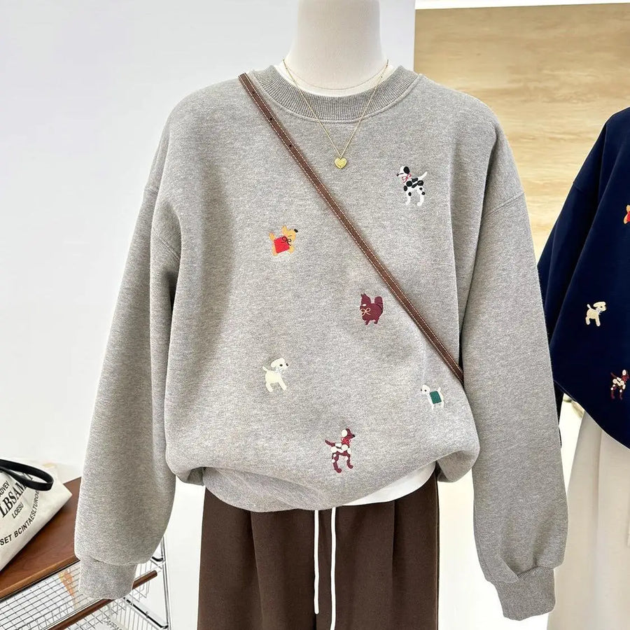 Comfortabel damessweatshirt met ronde hals, geborduurde hondenmotieven en lange mouwen