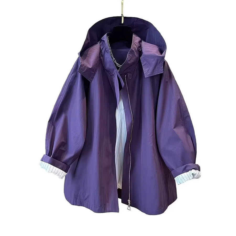 Loose-fitting mid-length women's jacket with stand-up collar, buttons, and hood