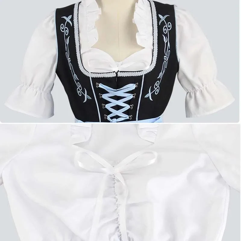 Sort og lyseblå dirndl-kjole med hvid bluse og broderet forklæde