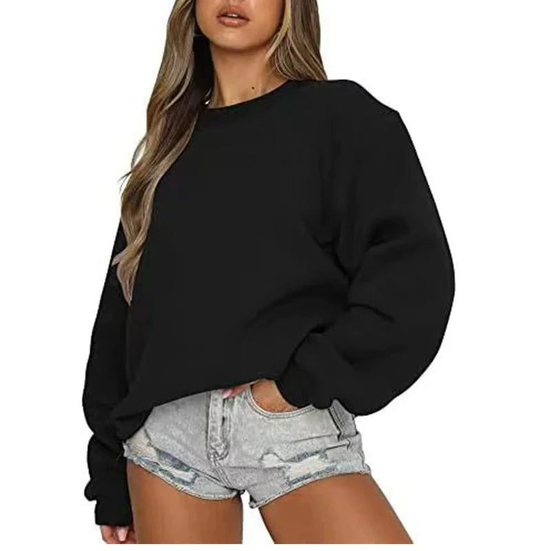 Ensfarvet, løstsiddende sweatshirt til kvinder med rund hals og lange ærmer