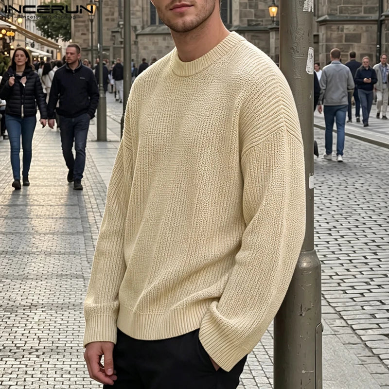 Men's loose-fit black ribbed crew-neck sweater with long sleeves