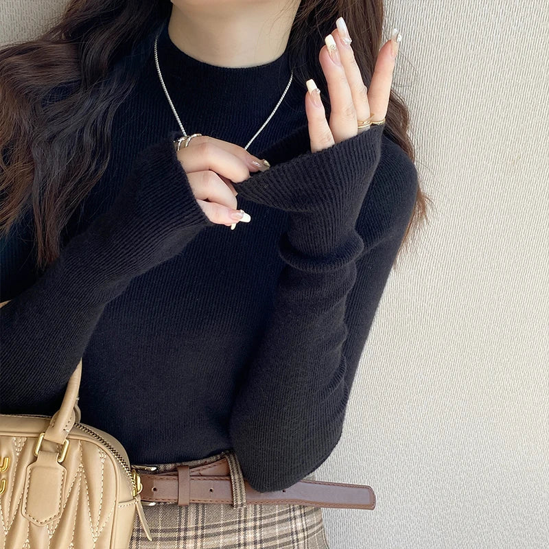 Suéter de mujer de cuello alto acanalado y manga larga con abertura para el pulgar, de color liso