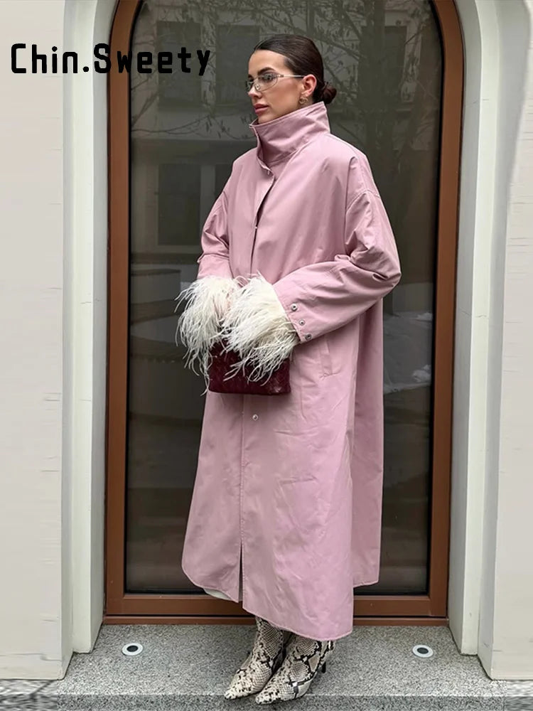 Trench-coat lungo da donna dalla vestibilità ampia ed elegante, con collo alto e maniche a sbuffo