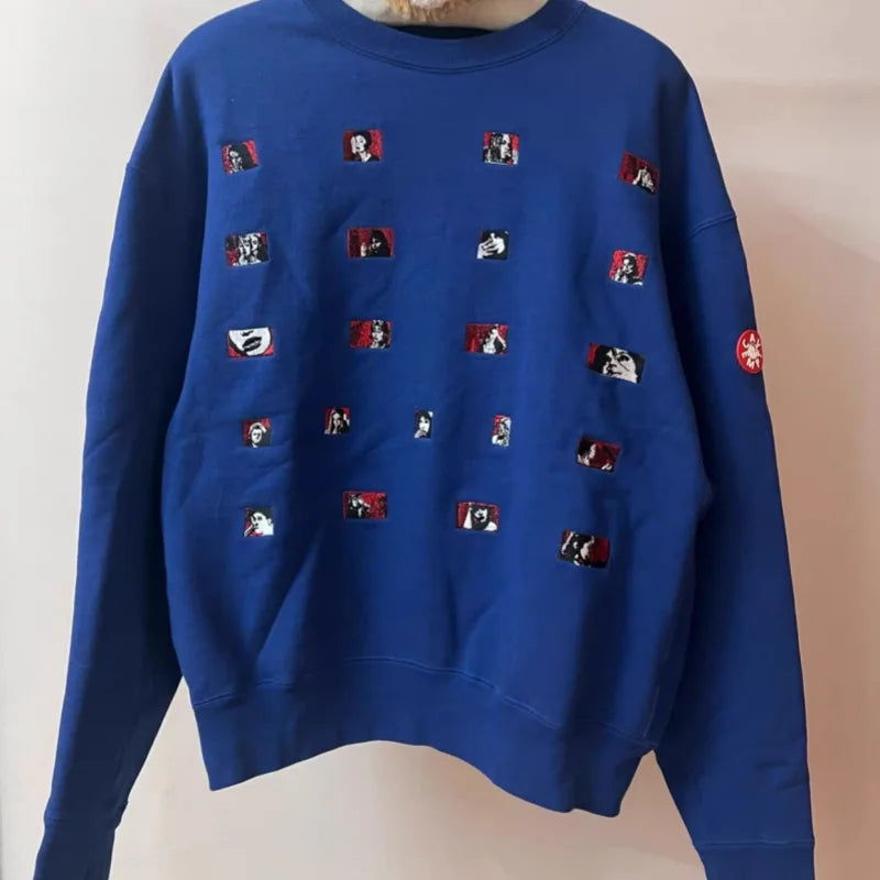 Unisex crew-neck sweatshirt with a graphic design, available in several colors and sizes