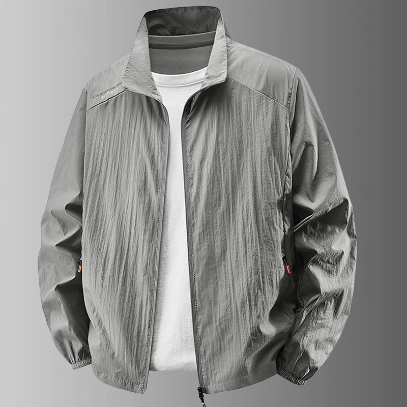 Chaqueta ligera lisa para hombre, cuello alto, corte informal y cierre de cremallera