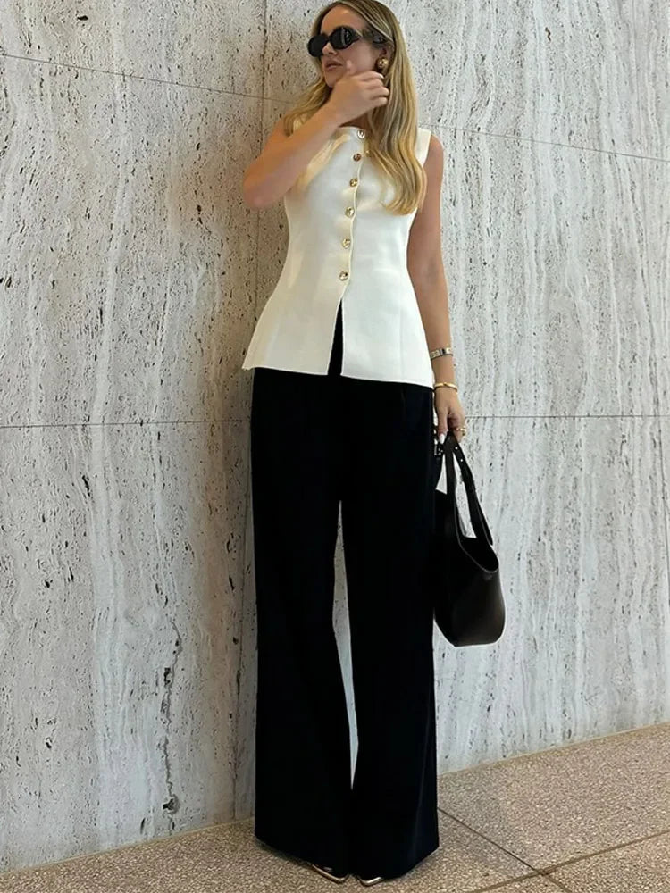 Women's sleeveless crew-neck top with decorative buttons