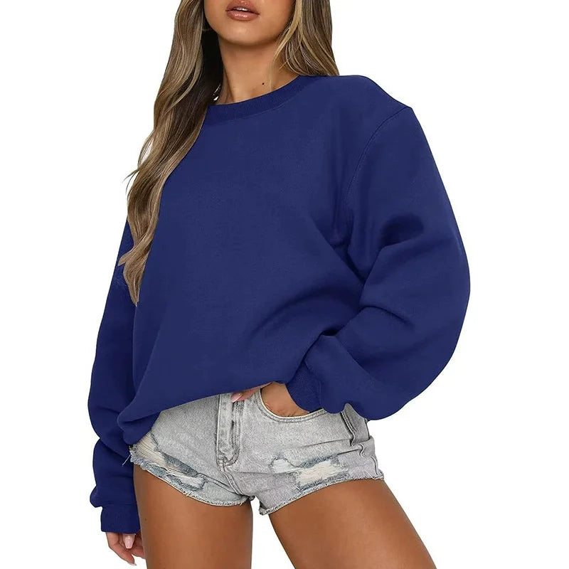 Ensfarvet, løstsiddende sweatshirt til kvinder med rund hals og lange ærmer