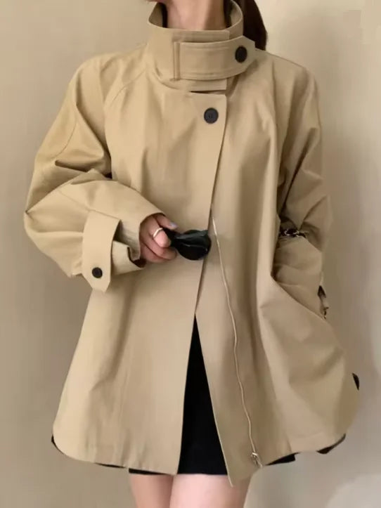Loose-fitting mid-length women's jacket with stand-up collar, buttons, and hood