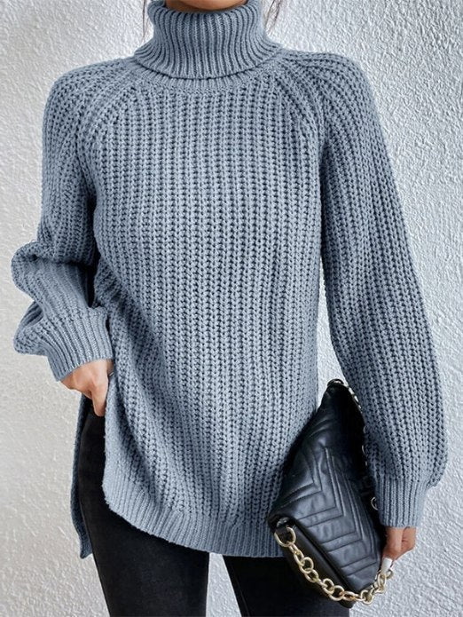 Damen-Rollkragenpullover aus lockerem Rippstrick mit Raglanärmeln und seitlichen Schlitzen