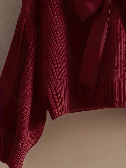 Pull en maille côtelée col V avec grand nœud décoratif pour femme