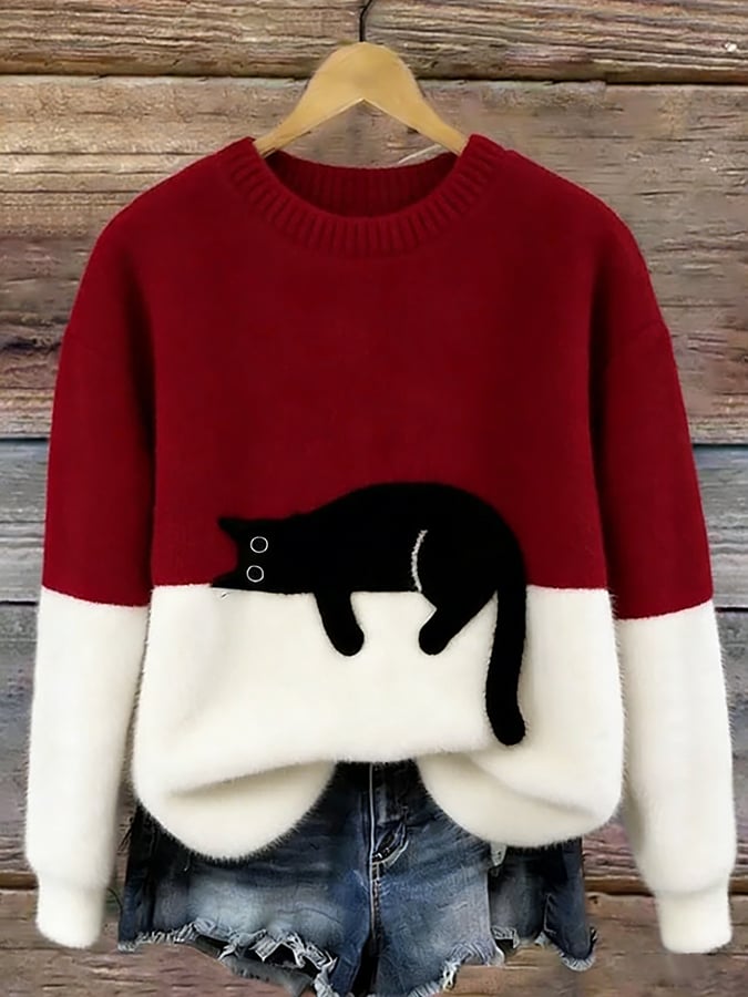Cozy two-tone sweater with black cat motif, long sleeves and crew neck