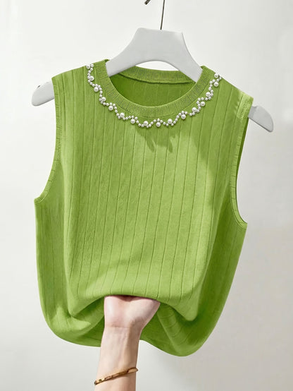 Elegante dames mouwloze top met parelmoerlook en ronde hals, geschikt voor uitgaan of kantoor