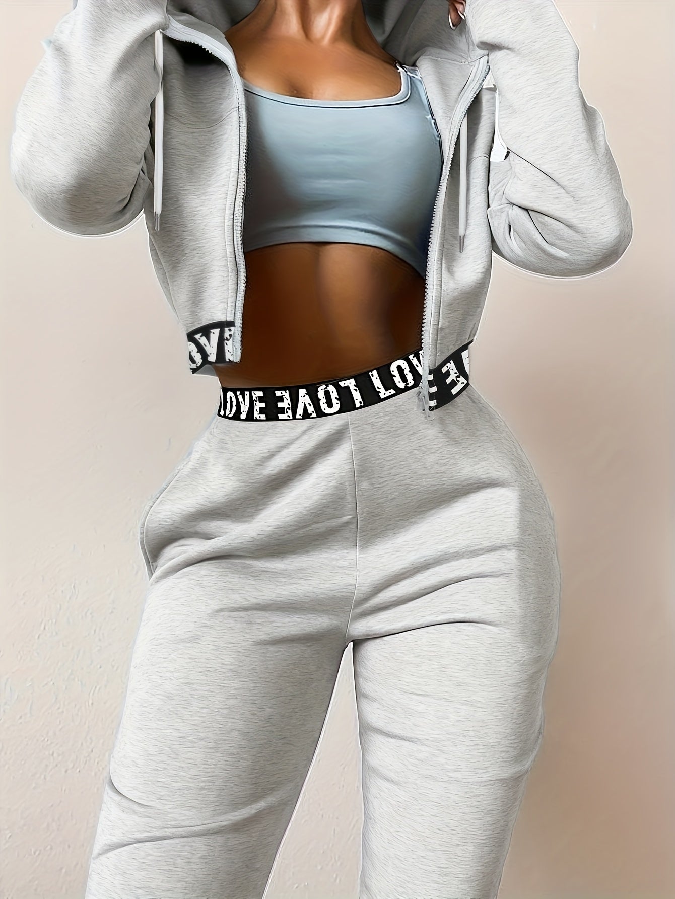 Ensemble survêtement femme crop top à capuche et pantalon large couleur unie