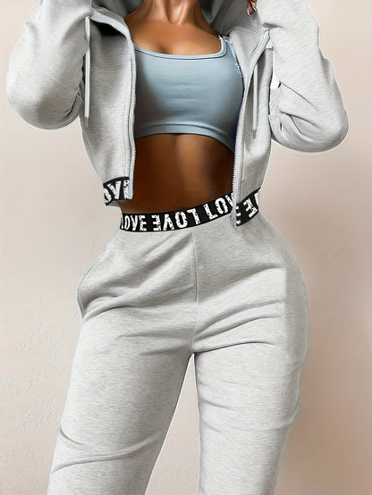 Ensemble survêtement femme crop top à capuche et pantalon large couleur unie