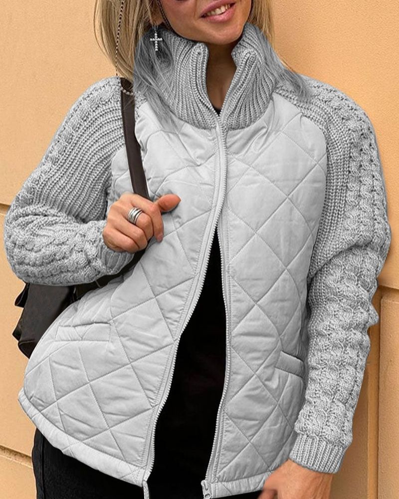 Women's quilted jacket with knitted sleeves and stand-up collar