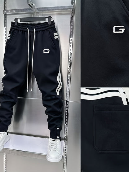 Pantalon de jogging homme avec cordon de serrage, rayures latérales et boutons pression, coupe fuselée