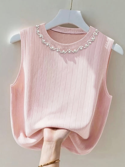 Elegante dames mouwloze top met parelmoerlook en ronde hals, geschikt voor uitgaan of kantoor