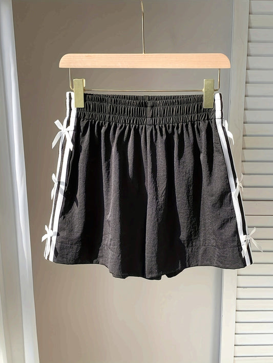 Short décontracté femme style vacances avec nœuds latéraux et bandes sportives
