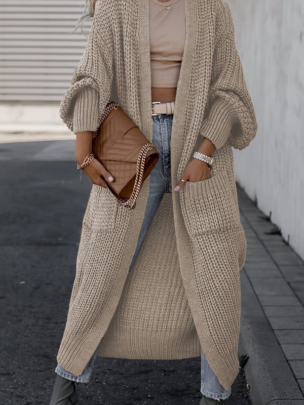 Cardigan long femme en maille épaisse avec poches et manches bouffantes